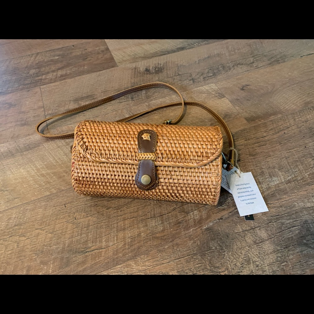 Woven handbag with leather features